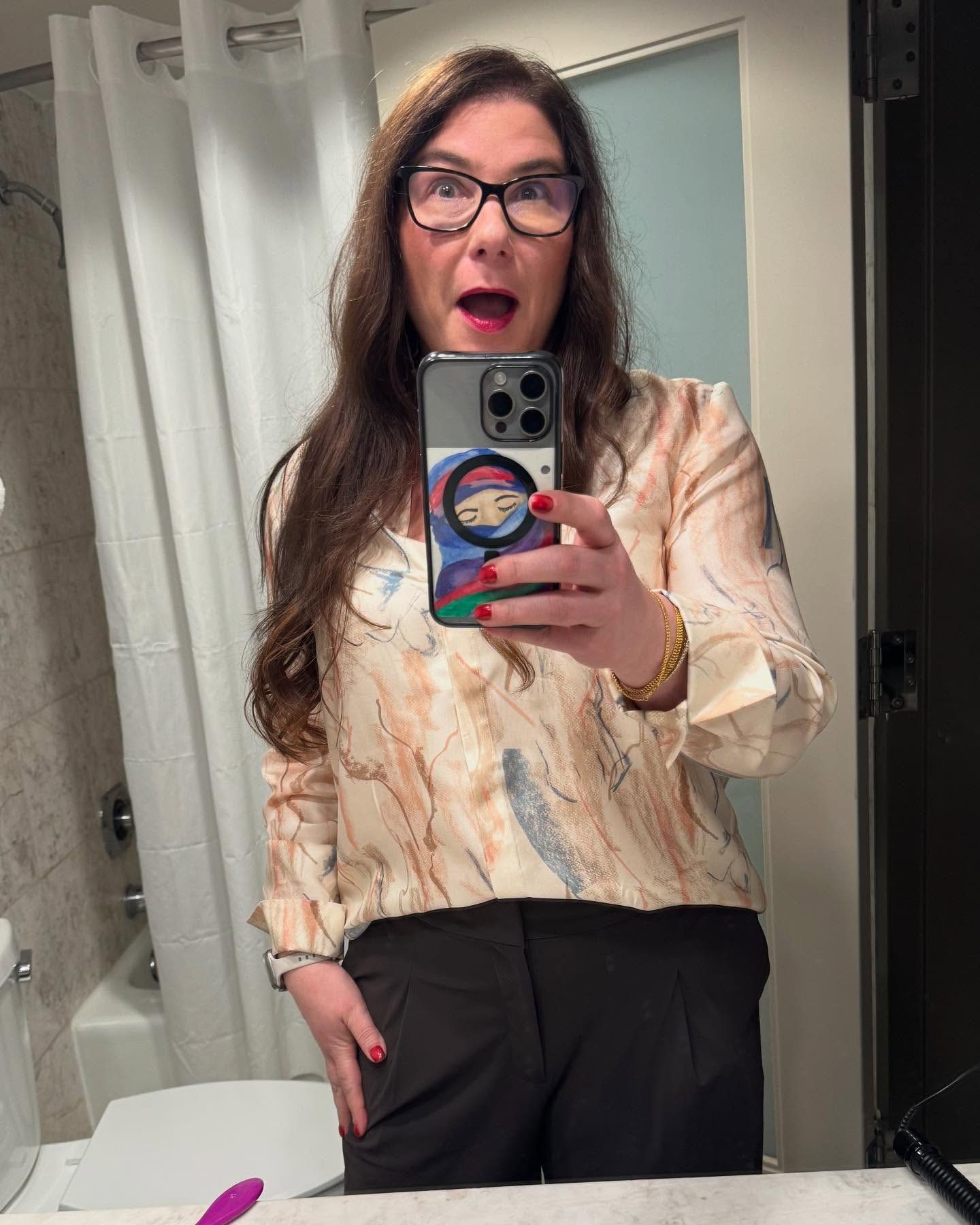 Vanessa in a silk blouse, mirror selfie at home